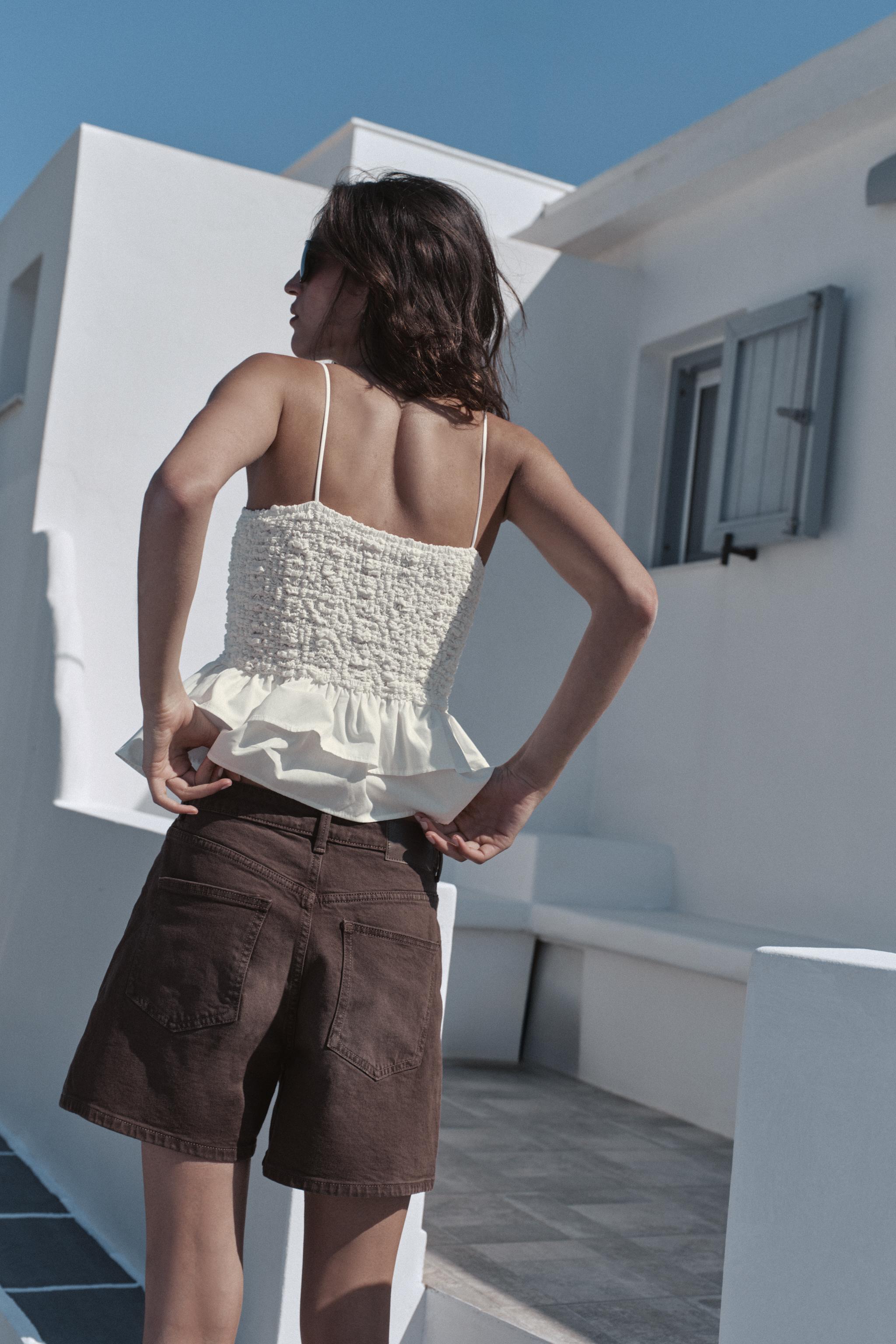 SMOCKED PEPLUM TOP